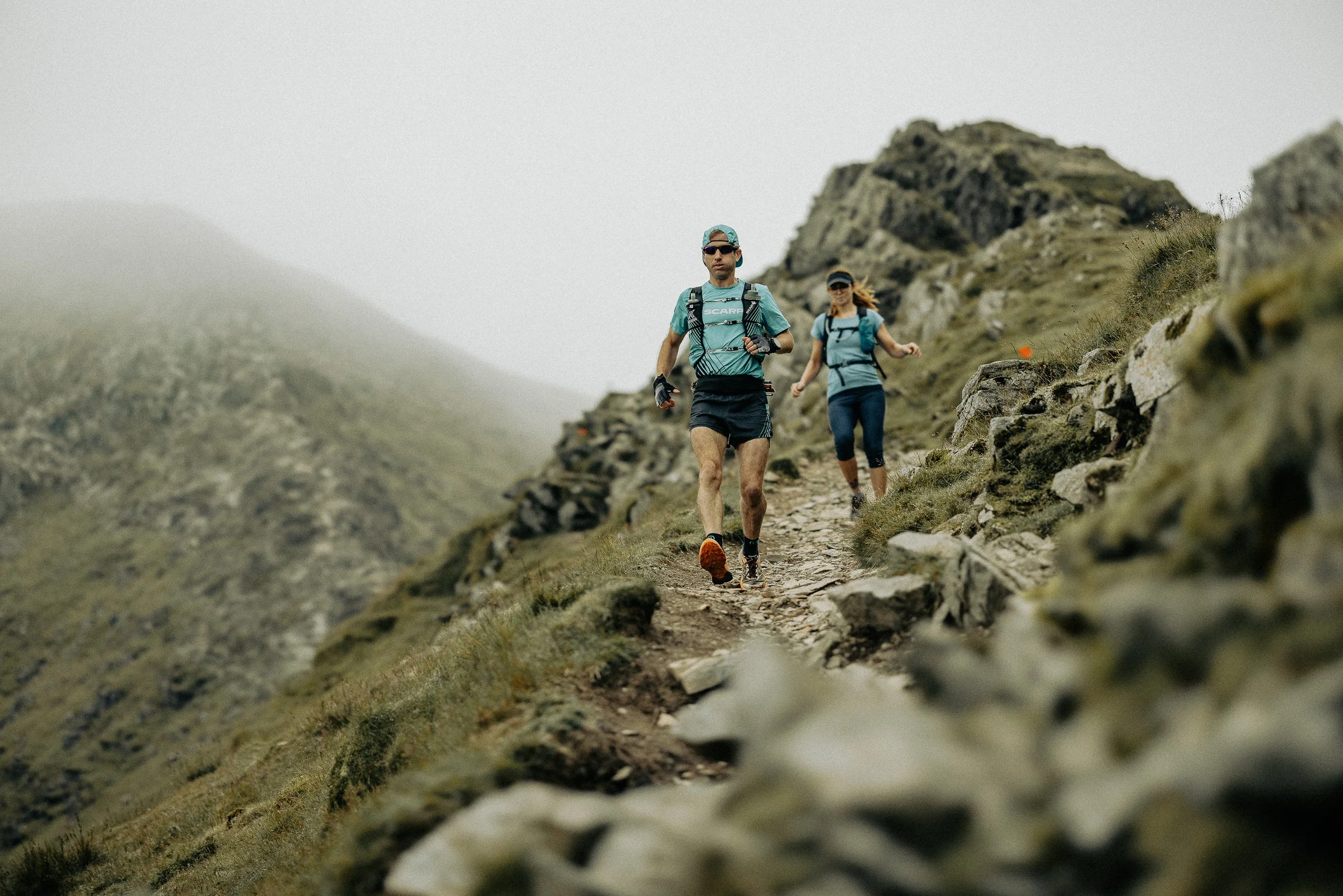 Trail runner on a mountain ridge line