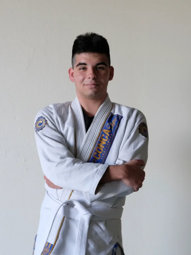 A Budo Scholar student in his jiu-jitsu gi, arms crossed