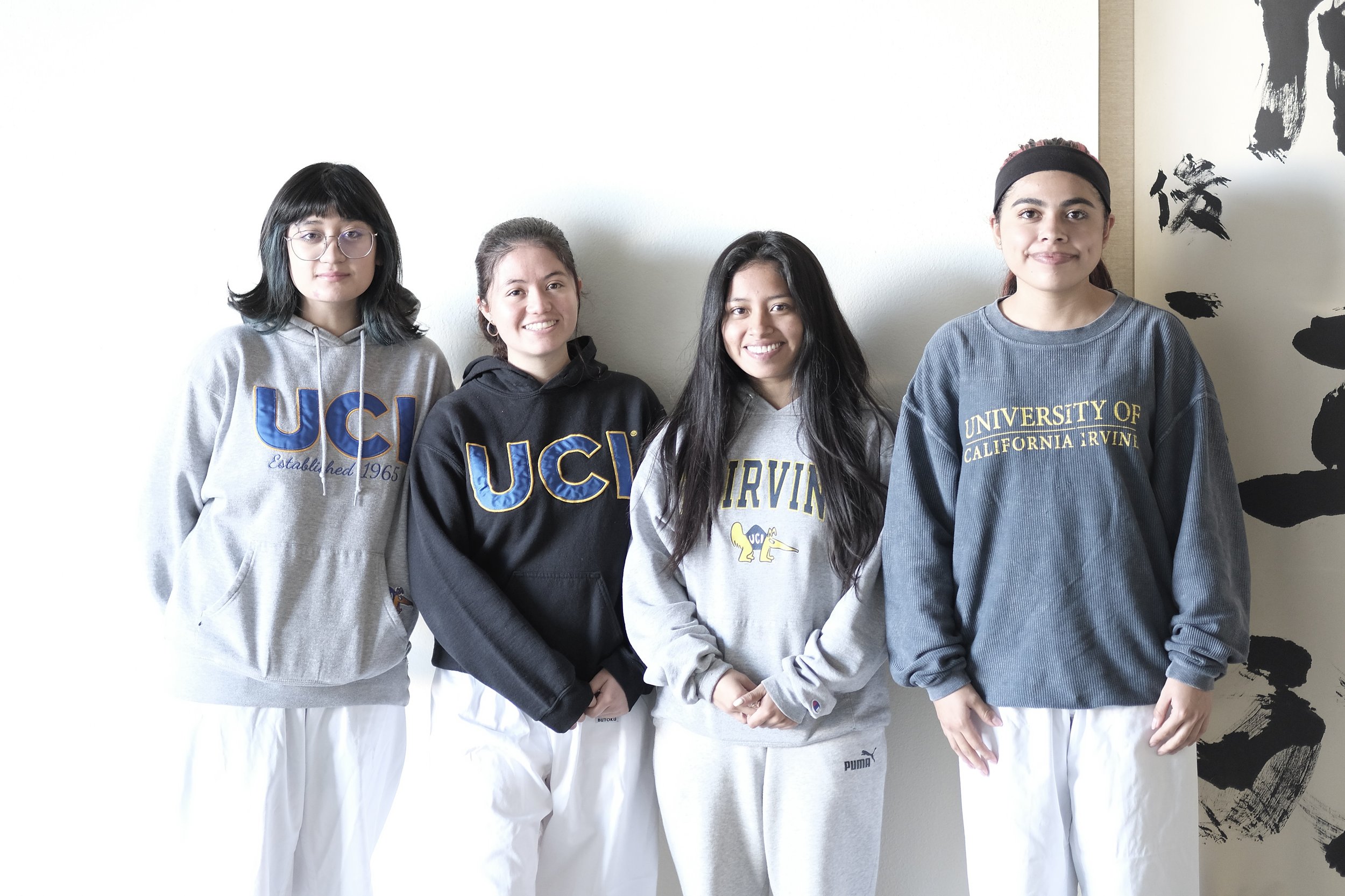 Four Budo Accelerator students from UC Irvine standing together in the dojo