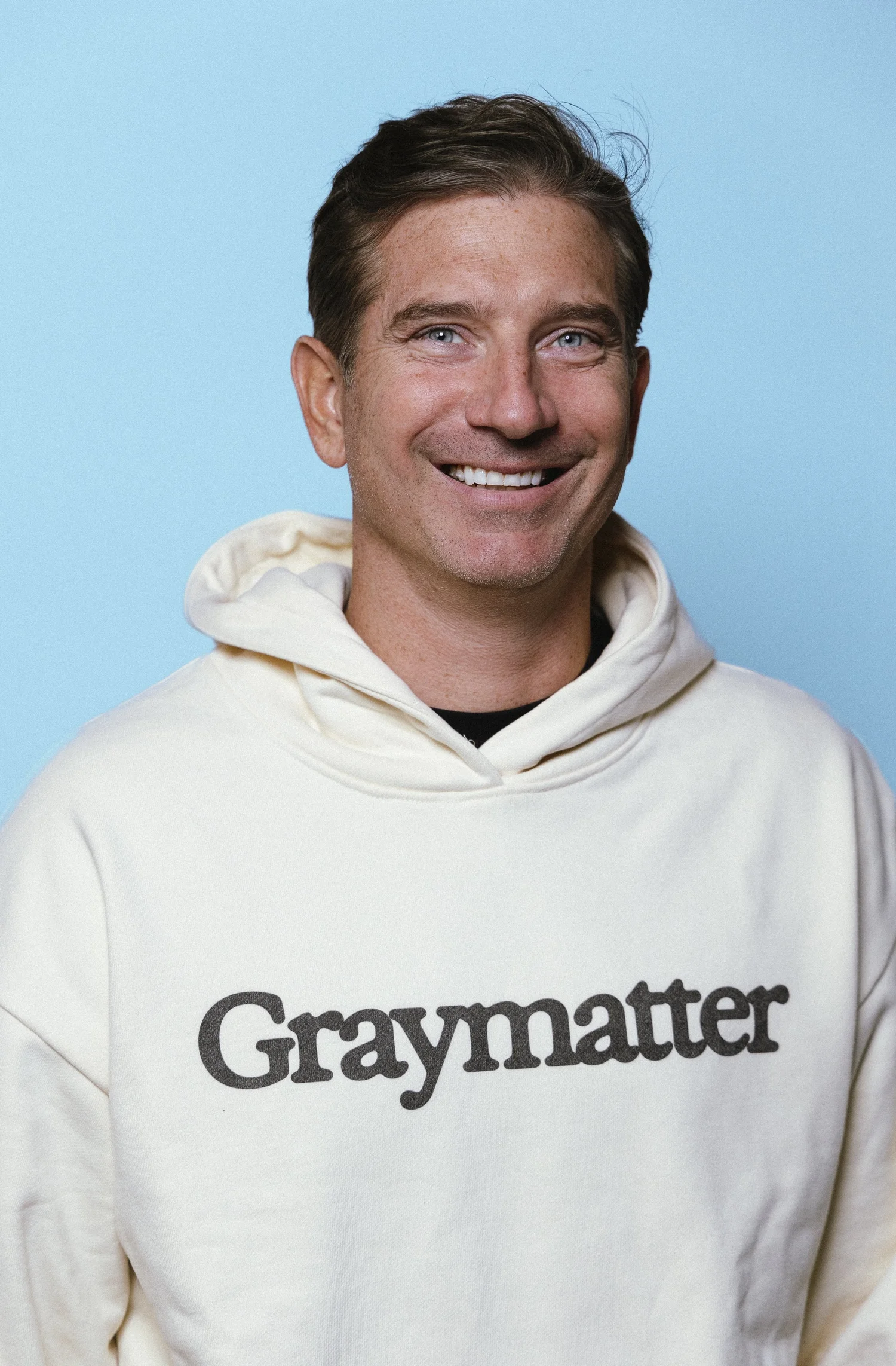 Jim Phillips smiling in a Graymatter sweatshirt