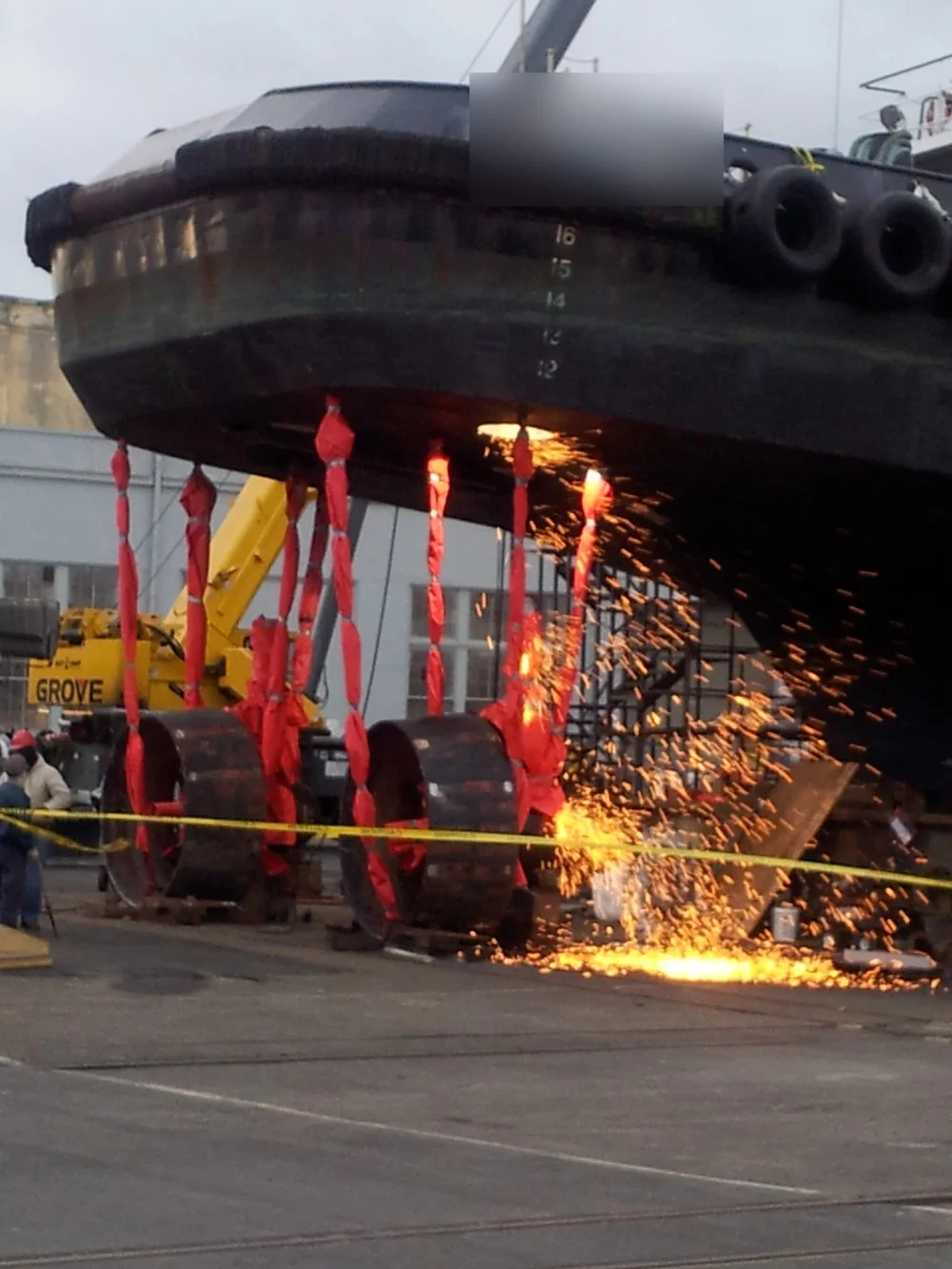 Tug in drydock during hull repair at a San Francisco Bay shipyard