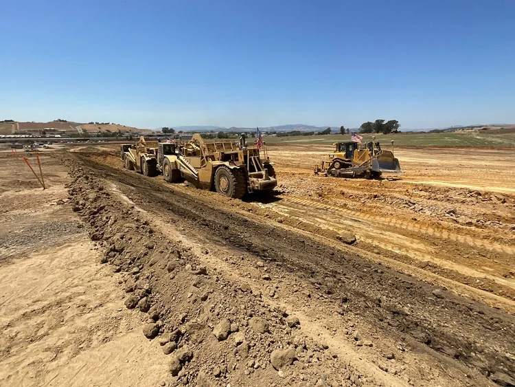 Scrapers grading the Watson Ranch hotel site