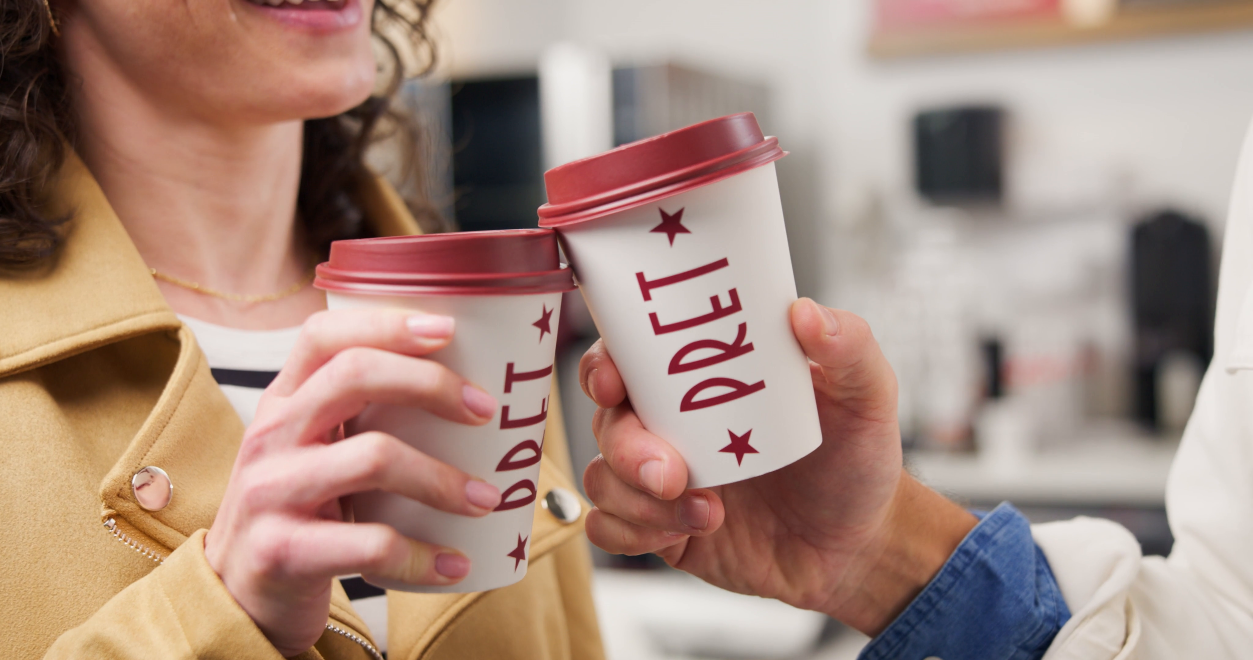 Two people share Pret coffee cups, a still from the Pret A Manger London coffee story