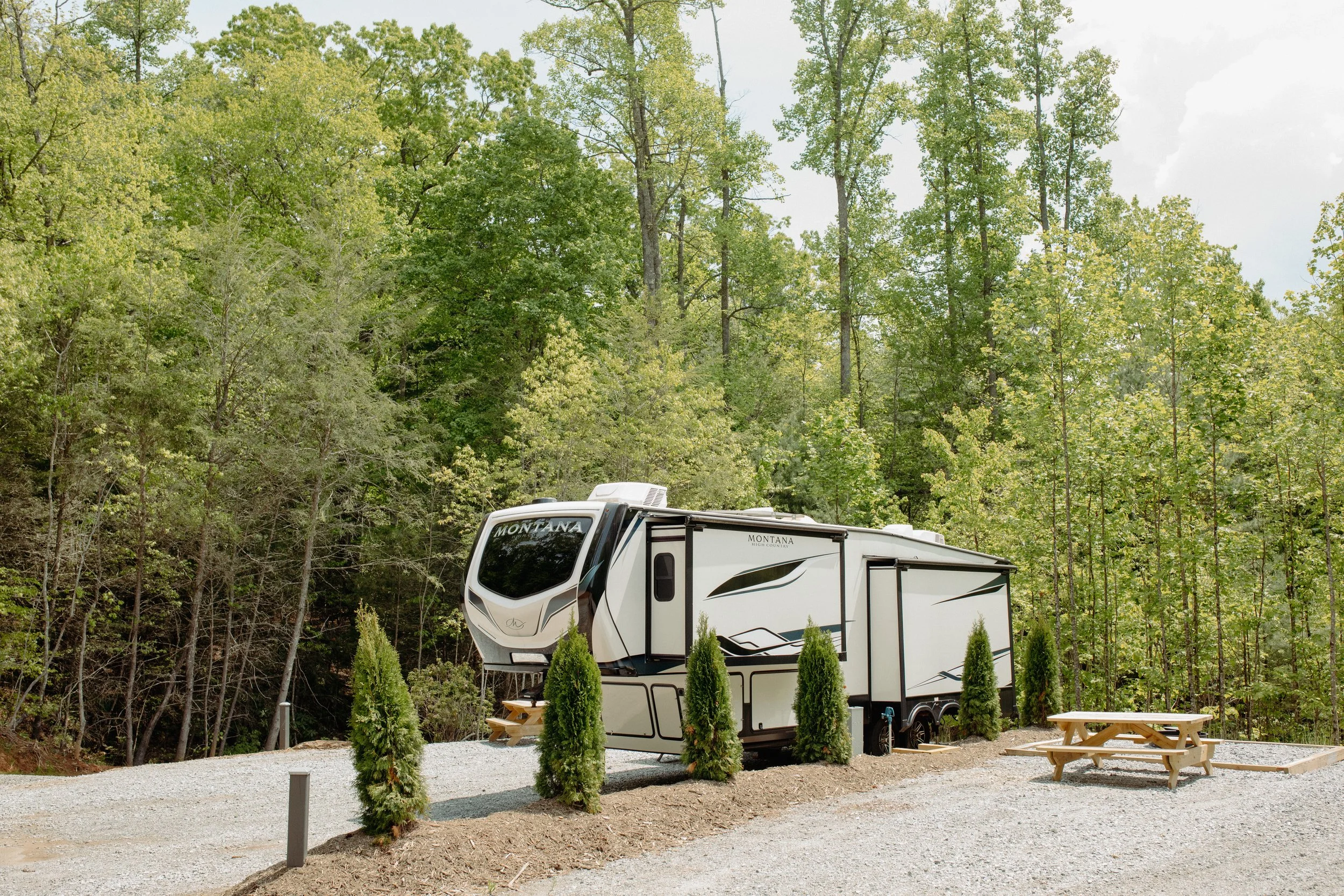 RV parked at a full hookup site on Old Cabin Loop at DuPont Yurts