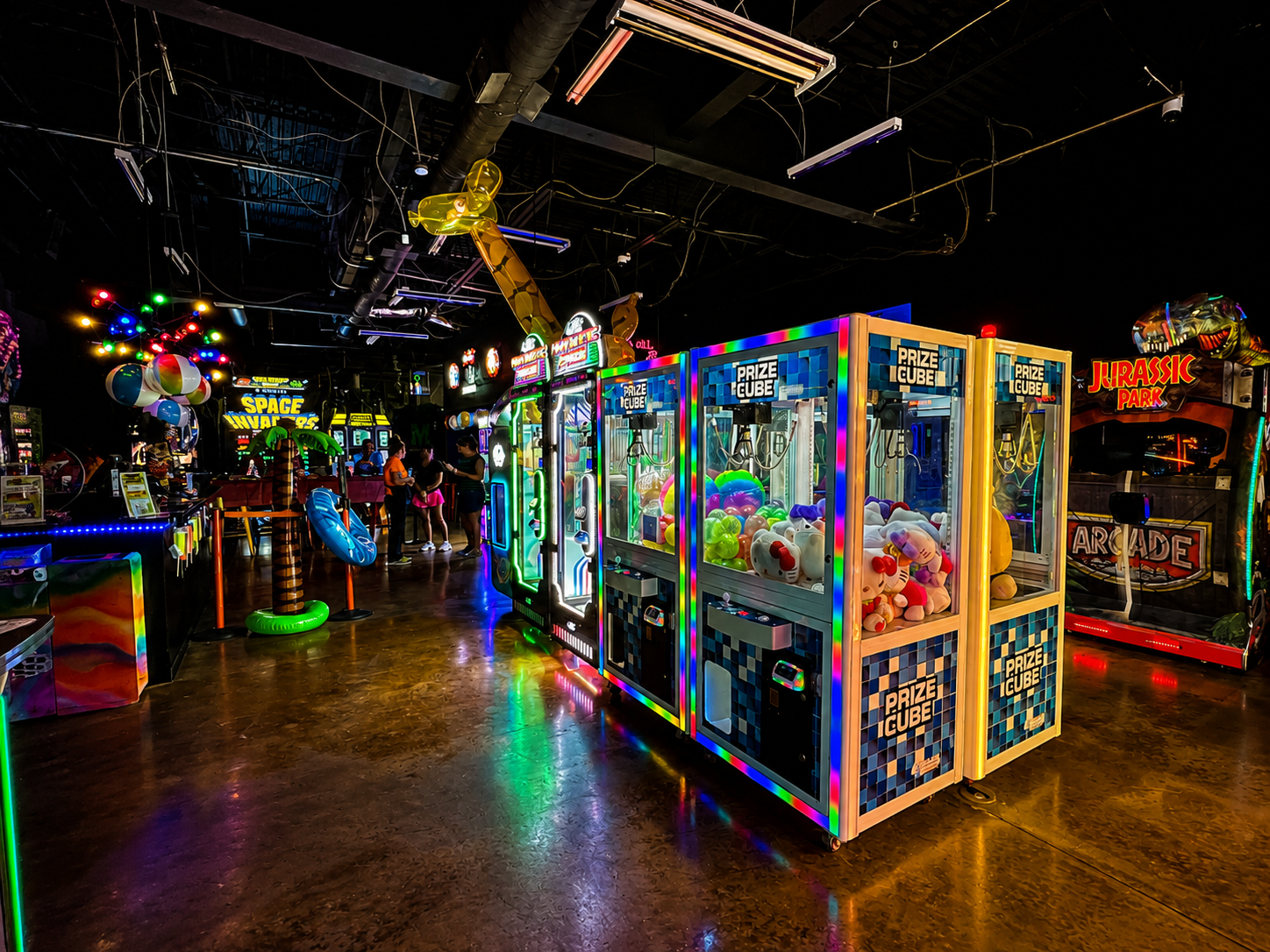 Prize Cube claw machines and Jurassic Park Arcade cabinet