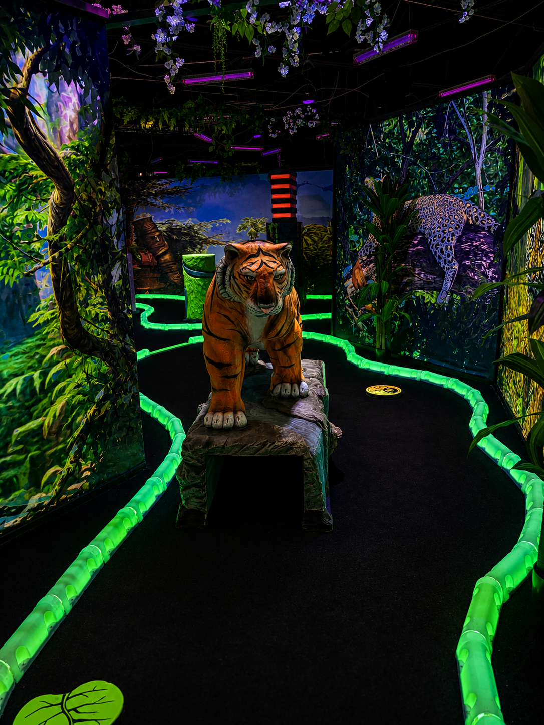 Shankz prehistoric jungle black light mini golf hole with glowing alligator