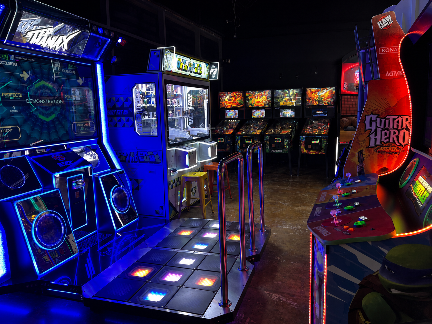 Full arcade floor with games and cabinets