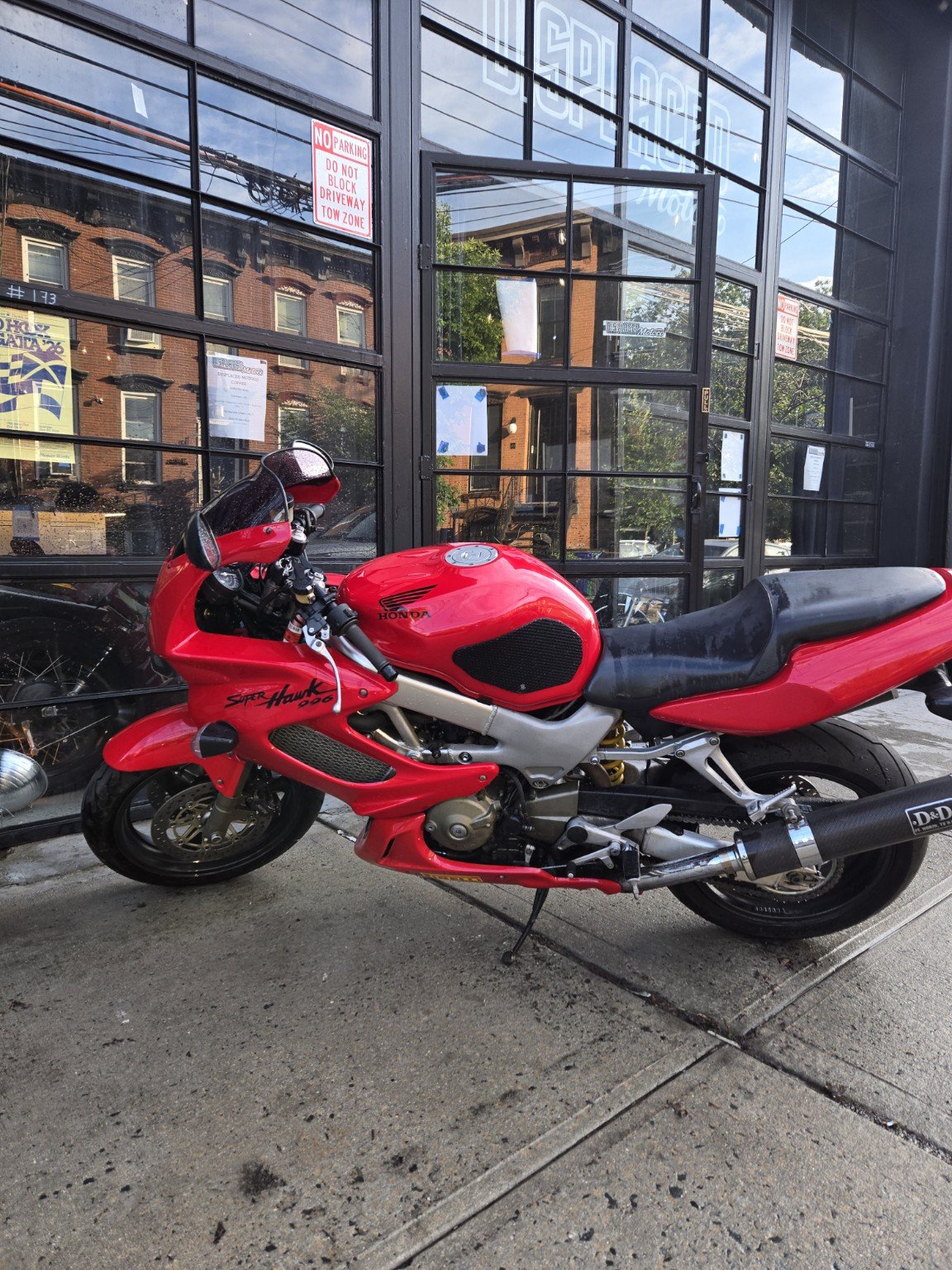 Red 2002 Honda VTR1000F Superhawk outside the Brooklyn workshop