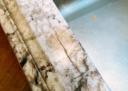 Before crack in granite repair at sink