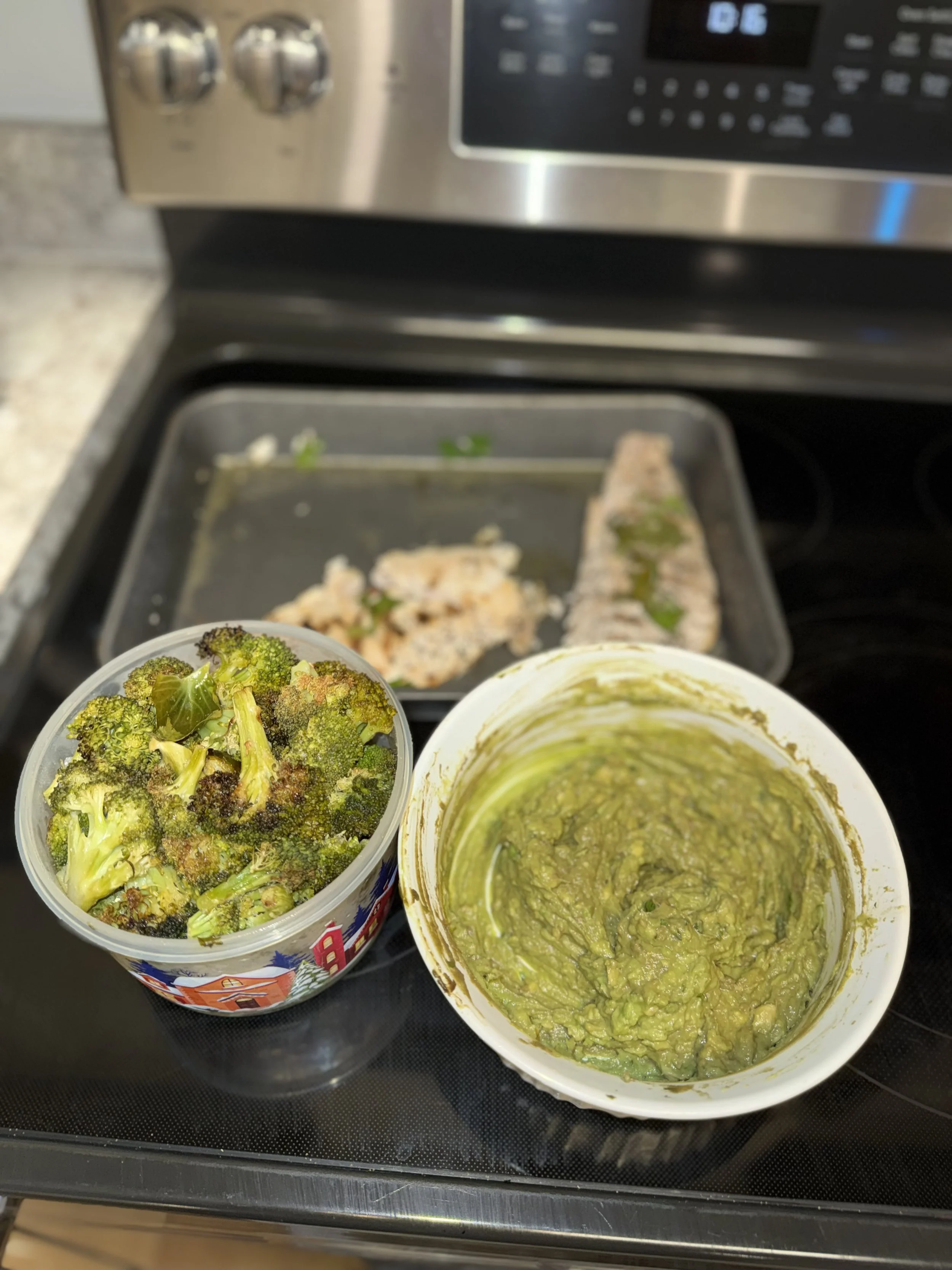 Meal prep containers with portioned healthy meals