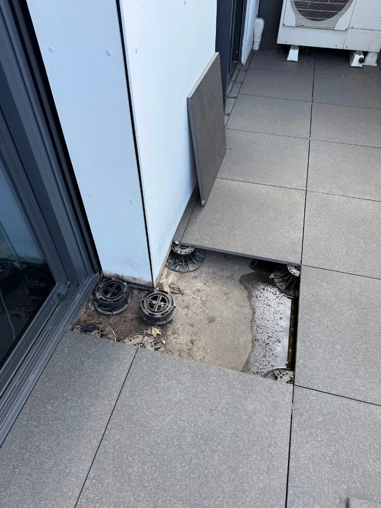 Pedestal pavers lifted on an Elsternwick apartment balcony to check the drain and membrane underneath