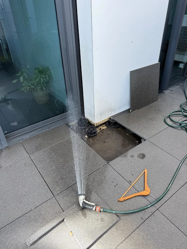 Spray test along a balcony sliding door frame on an Elsternwick apartment
