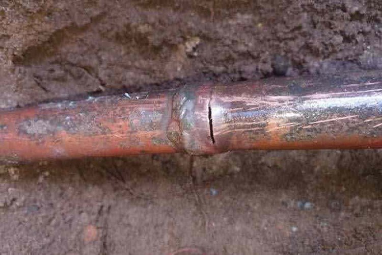 Split copper water pipe found during a leak inspection