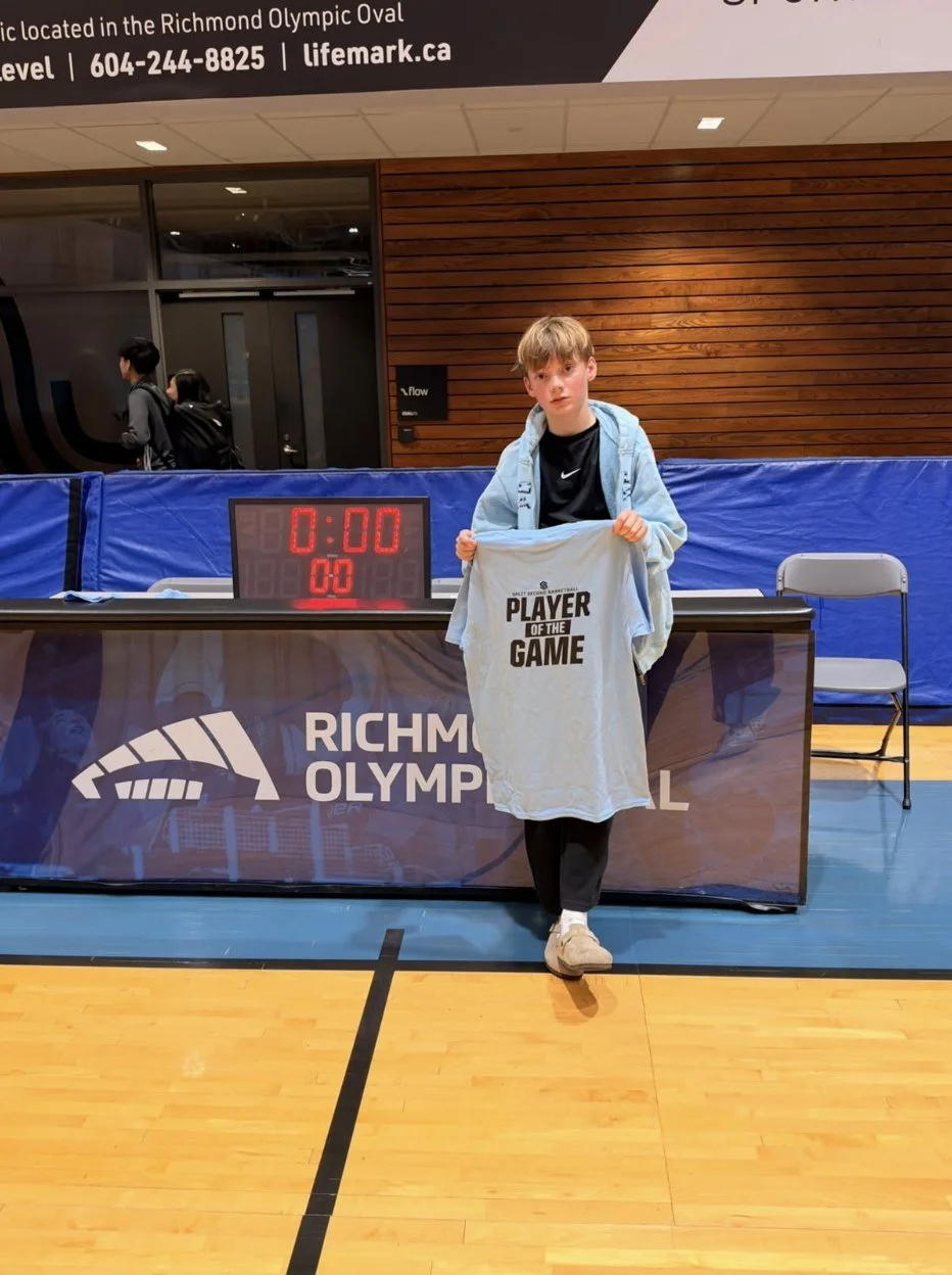 Nicholas holding his Player of the Game shirt