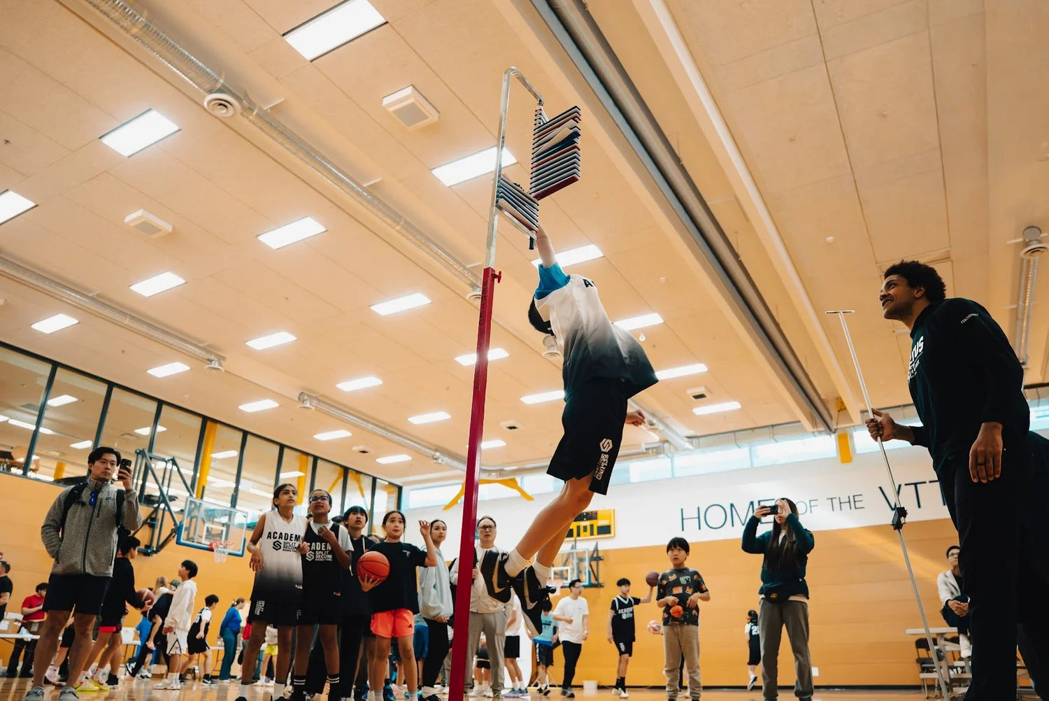 An Academy player at the top of a vertical jump