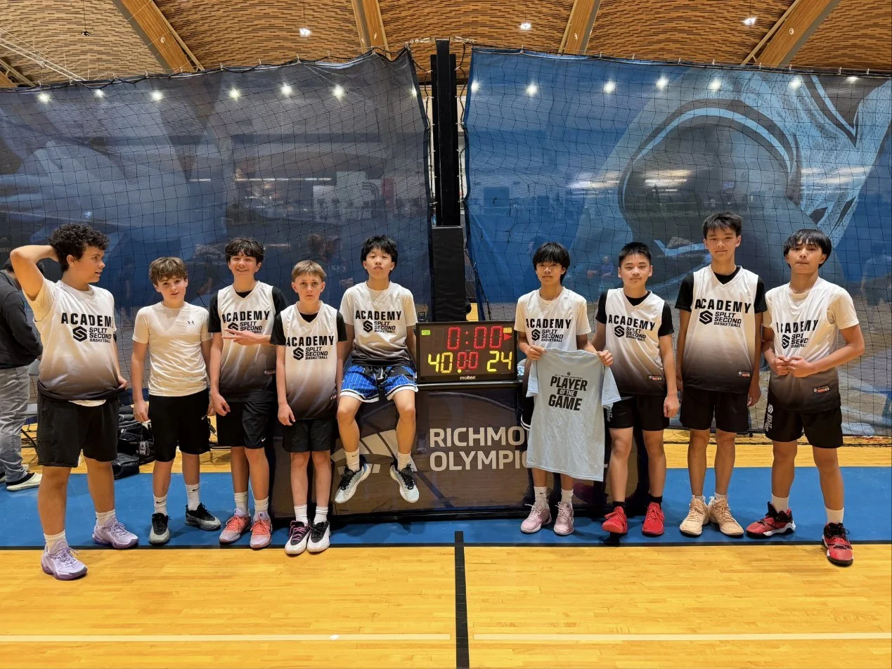 The Lakers team photo with Woody holding the Player of the Game shirt