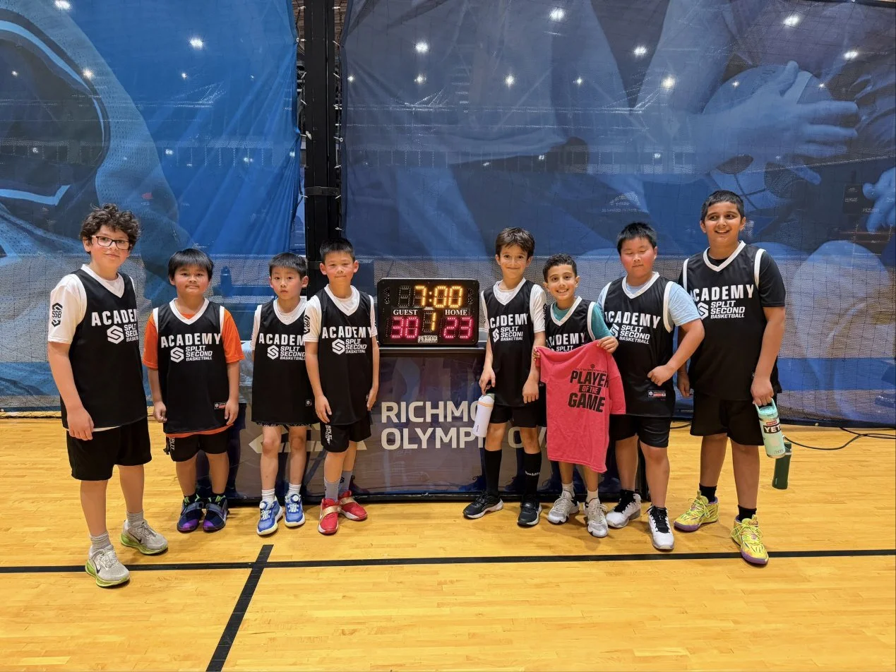 The Red Birds team photo with Jaylen holding the Player of the Game shirt