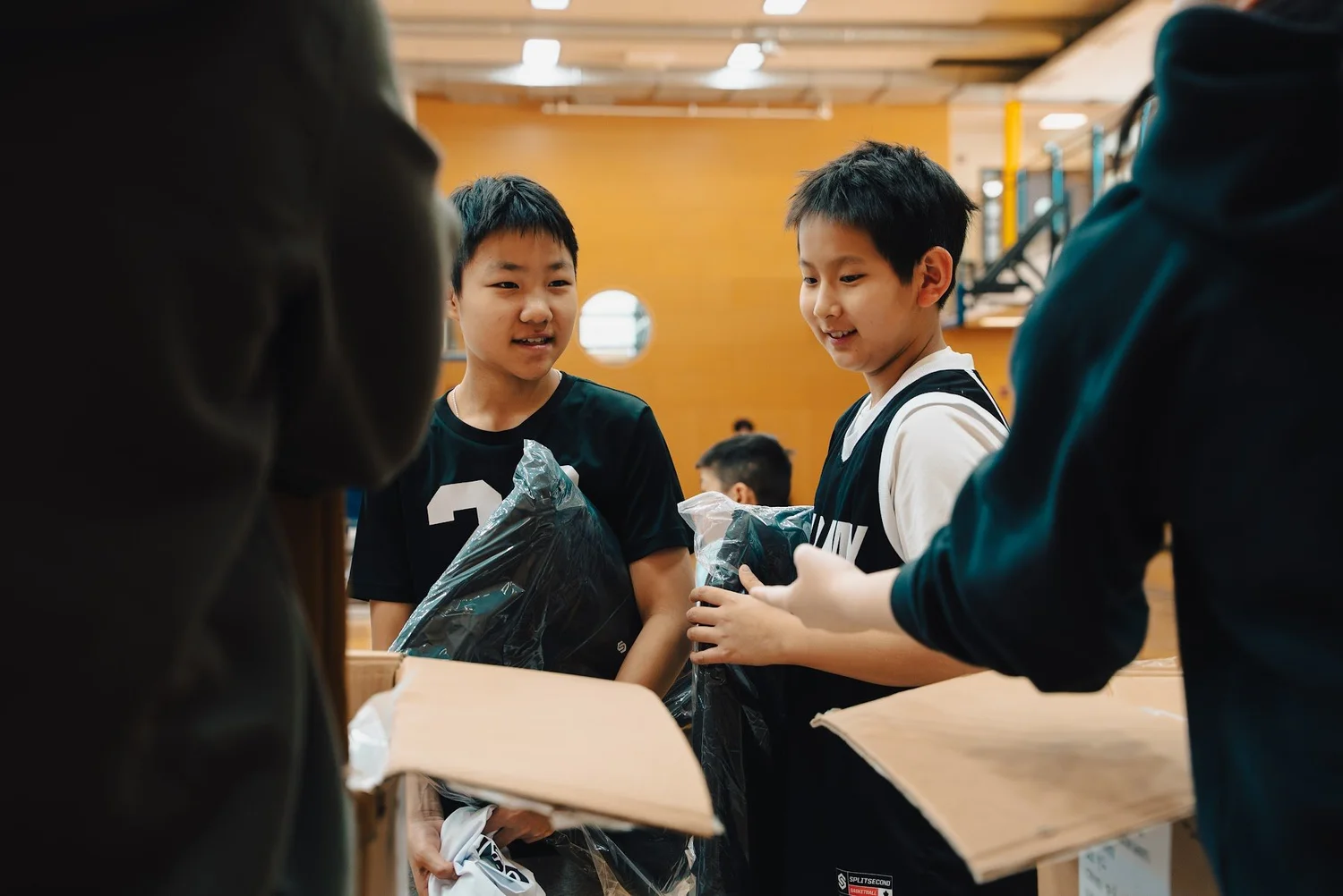 Academy players opening their new gear bags