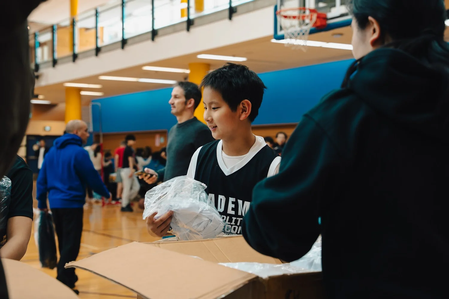 An Academy player picking up his gear
