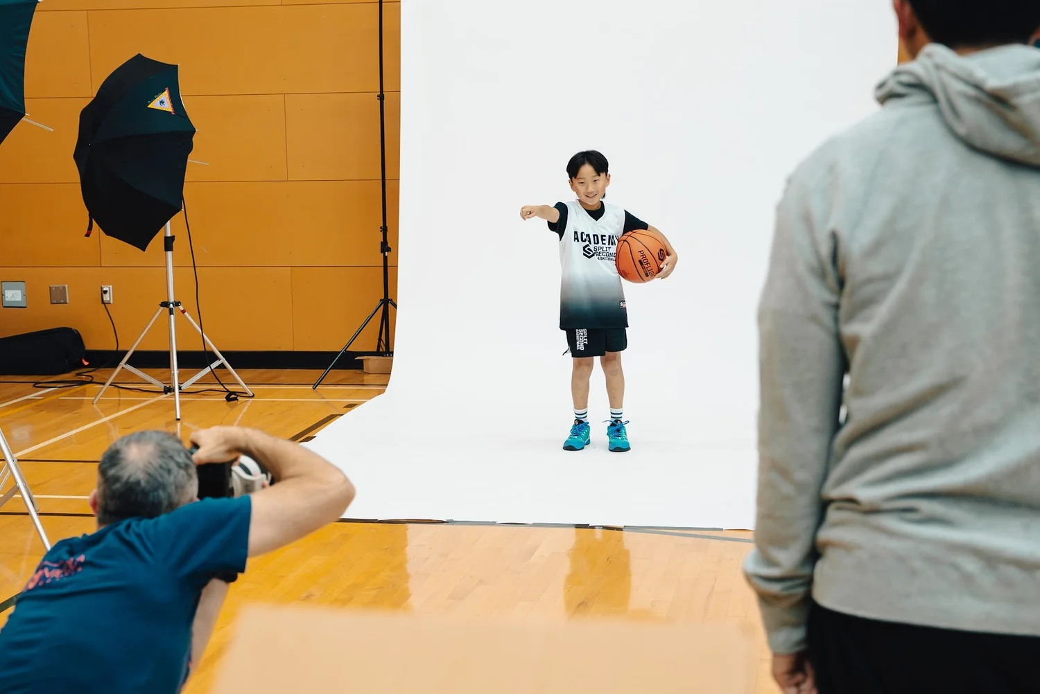 Josh Bowie photographing an Academy player on the studio set
