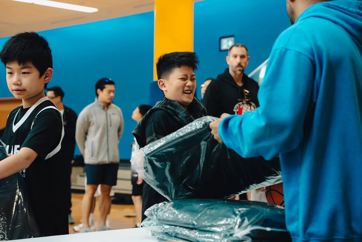 Academy players collecting gear from the boxes