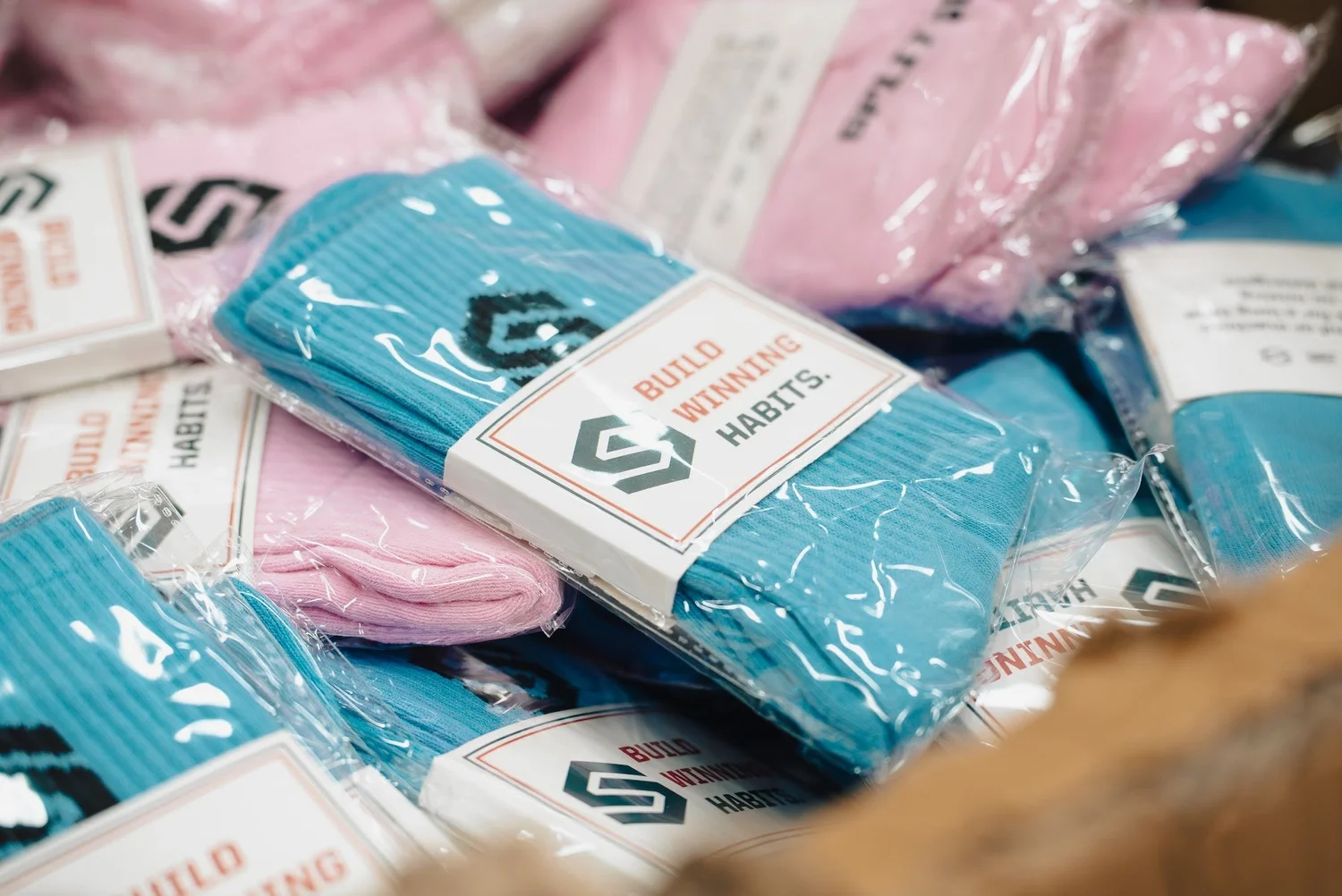 Build Winning Habits socks in their packaging
