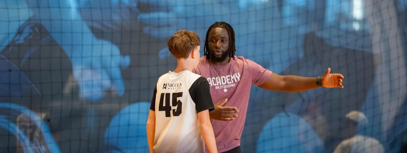 Jeremiah Kabia coaching an Academy player at the Richmond Olympic Oval