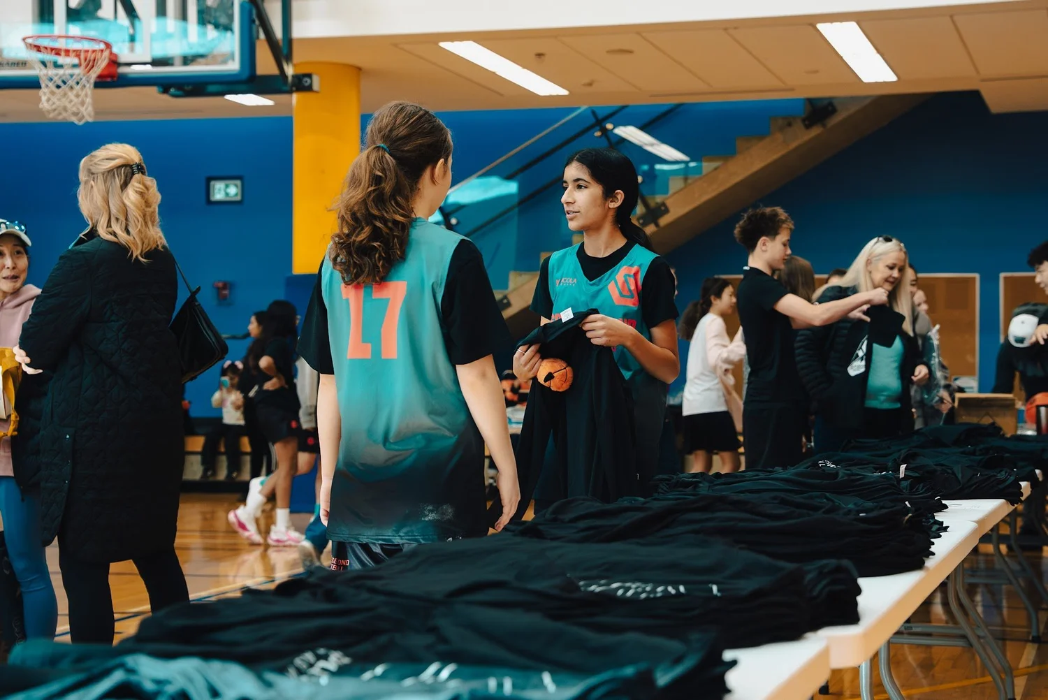 Cobra players and parents at the gear tables