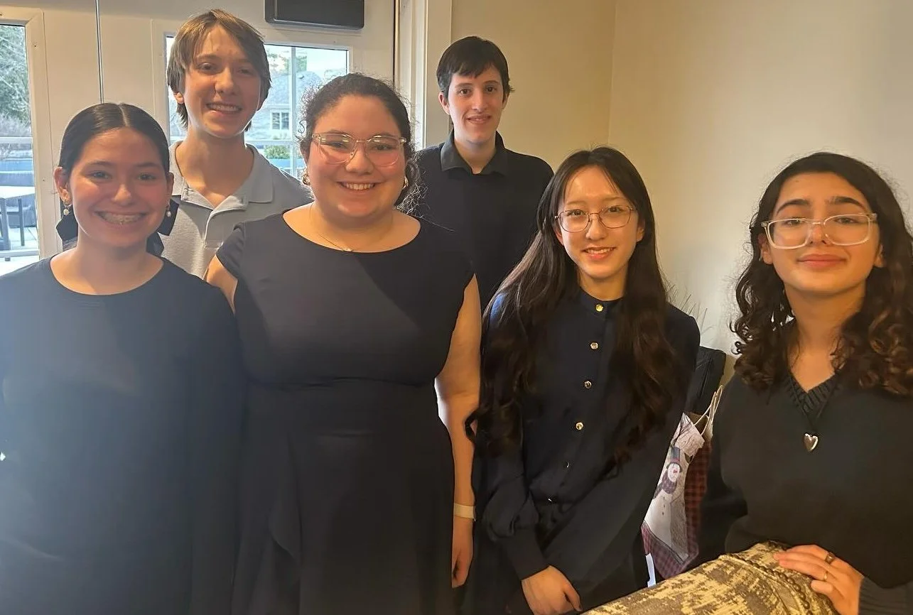 Student musician performing outreach concert