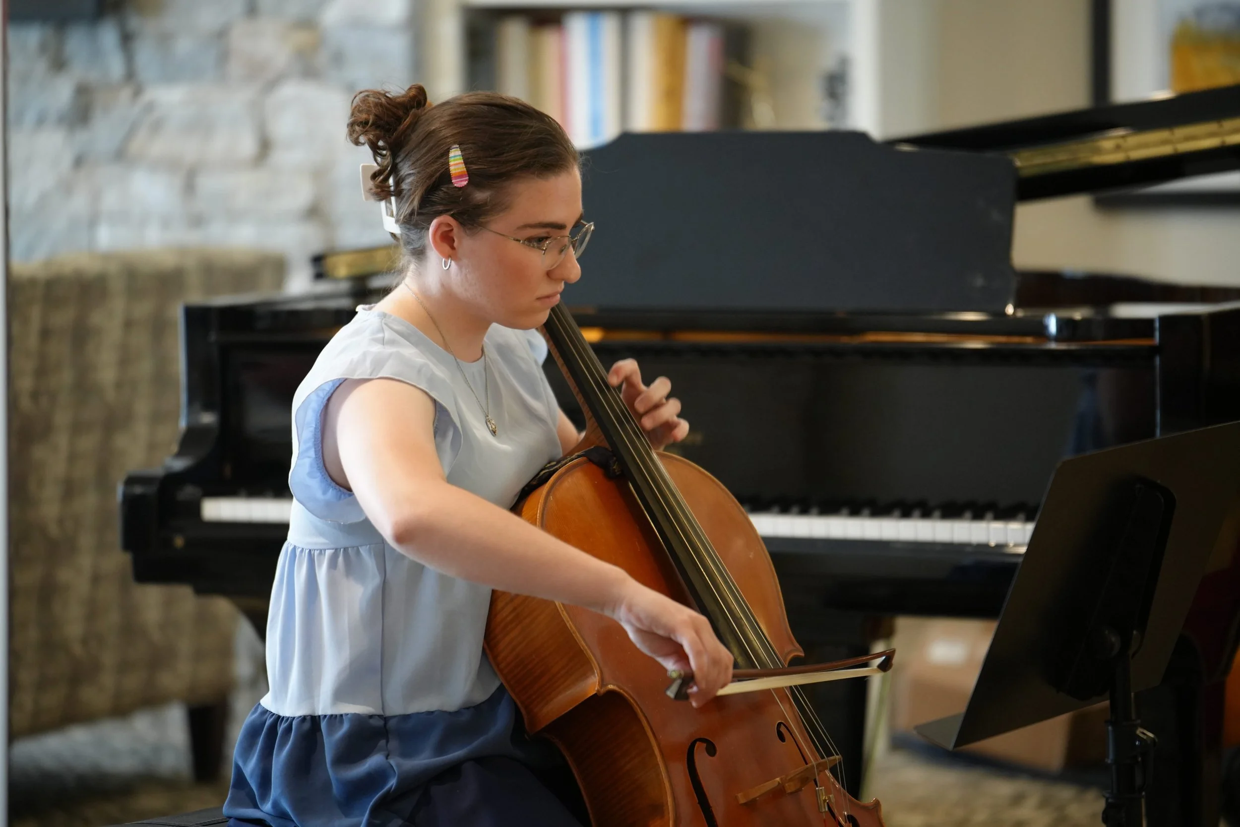 Student performing for community residents