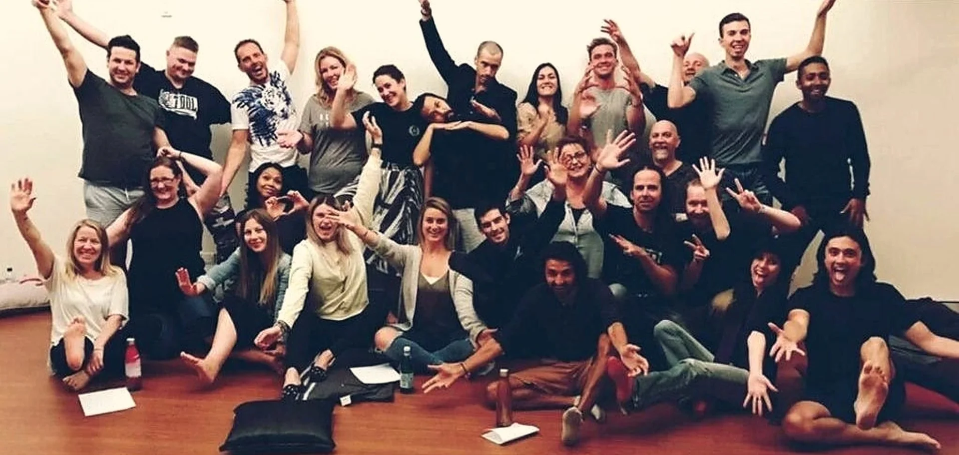 Workshop participants celebrating together at the end of a session