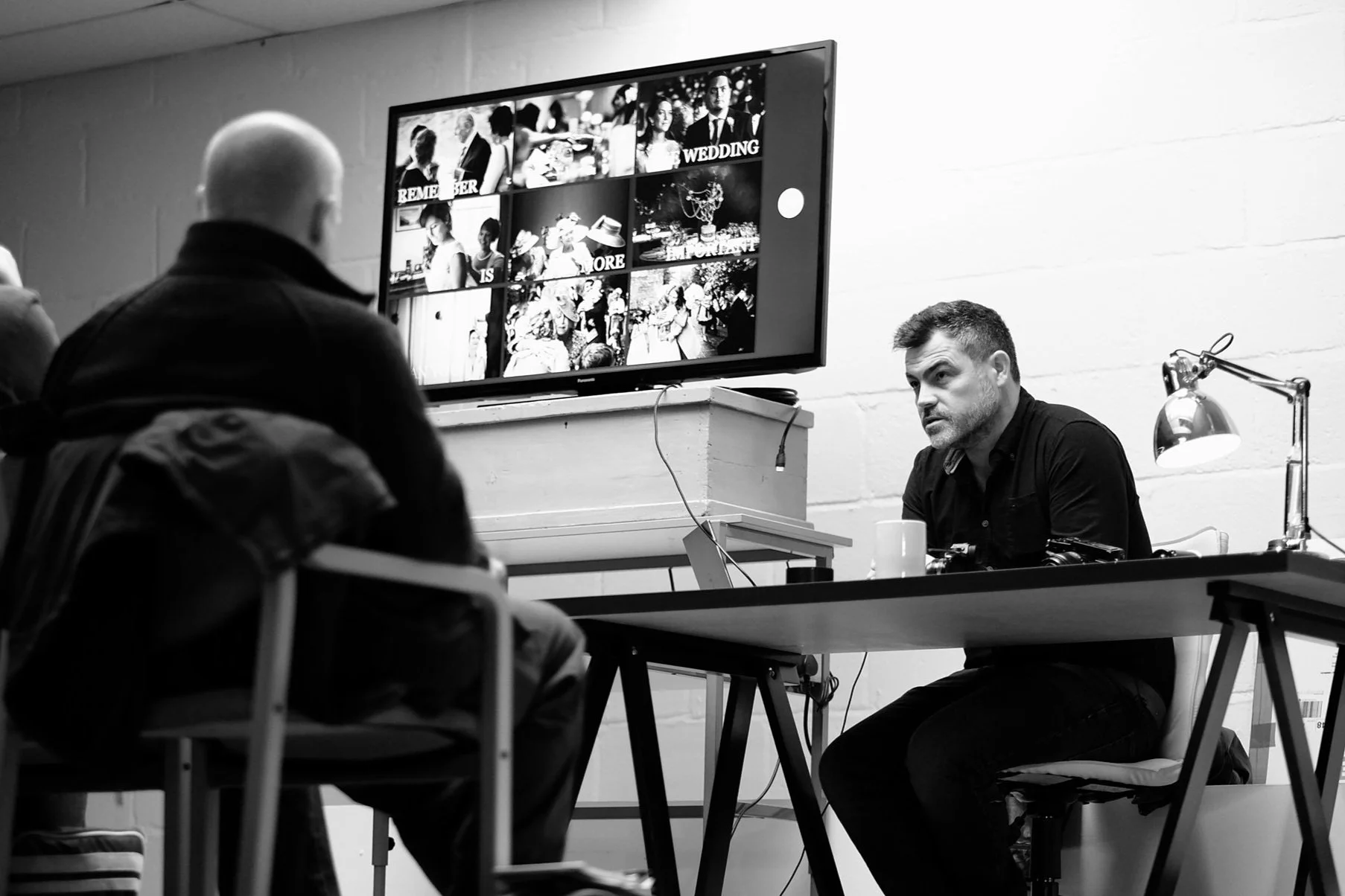 Kevin Mullins teaching photographers during a documentary wedding photography mentoring session