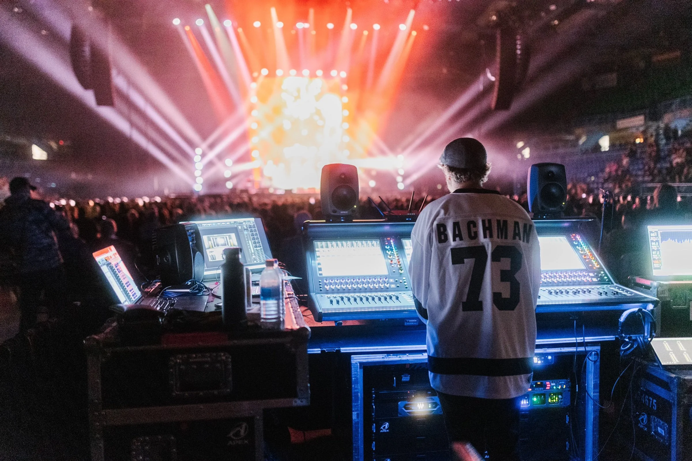 Daryl Chonka mixing BTO at the front of house console, wearing a Bachman 73 hockey jersey