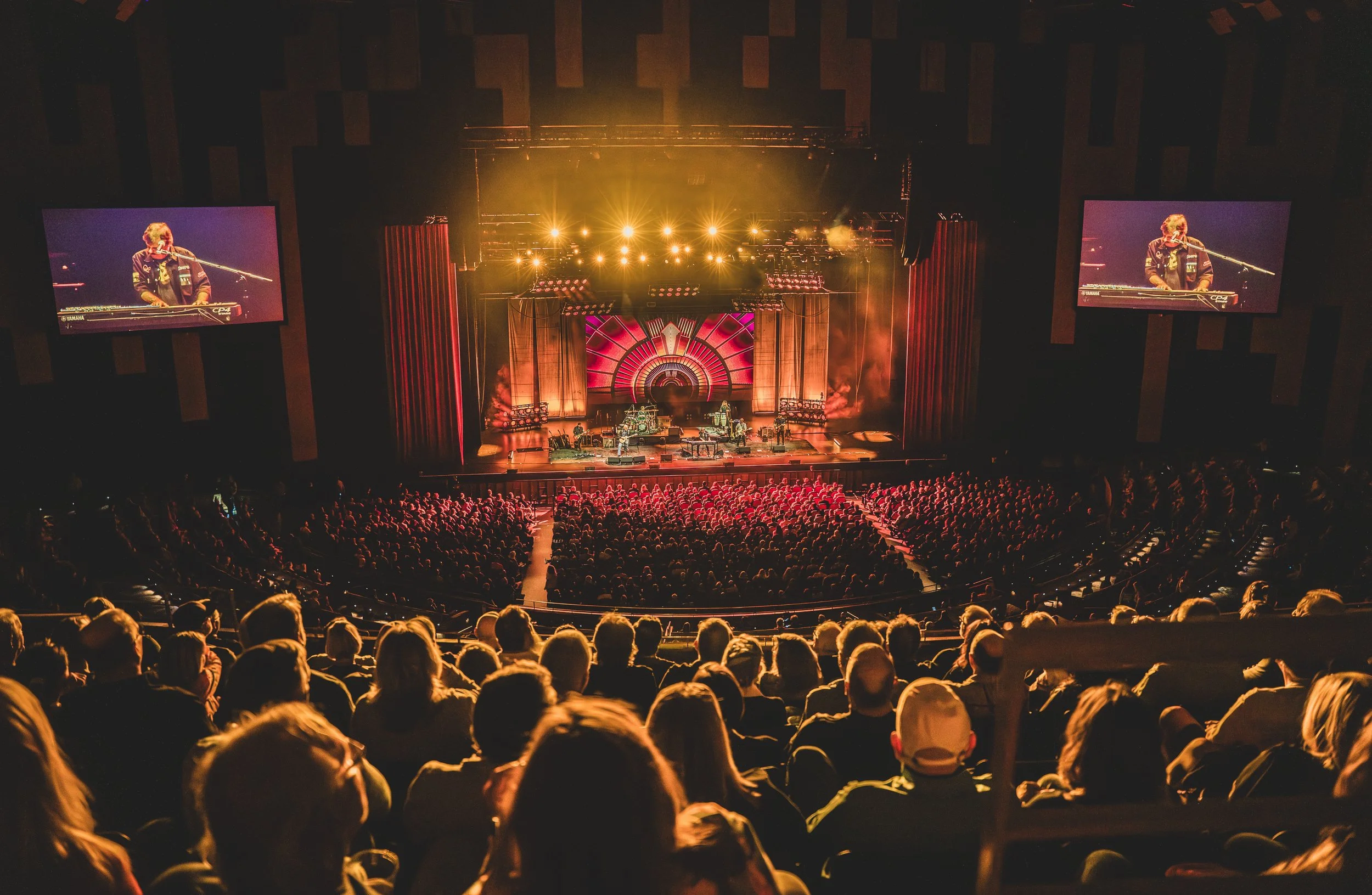 The Guess Who performing in a full theatre