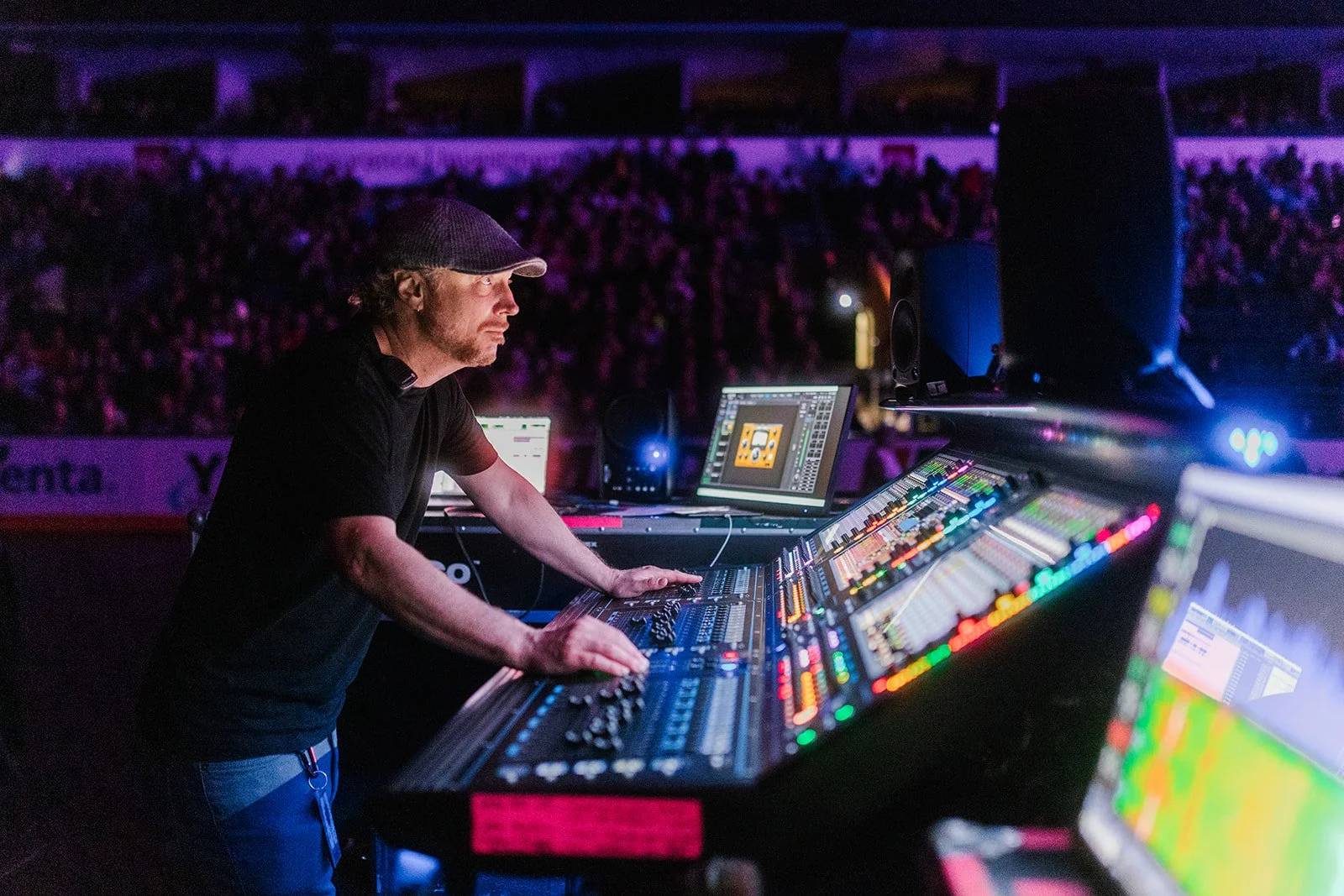 Daryl Chonka working at the BTO mixing console under purple and blue light