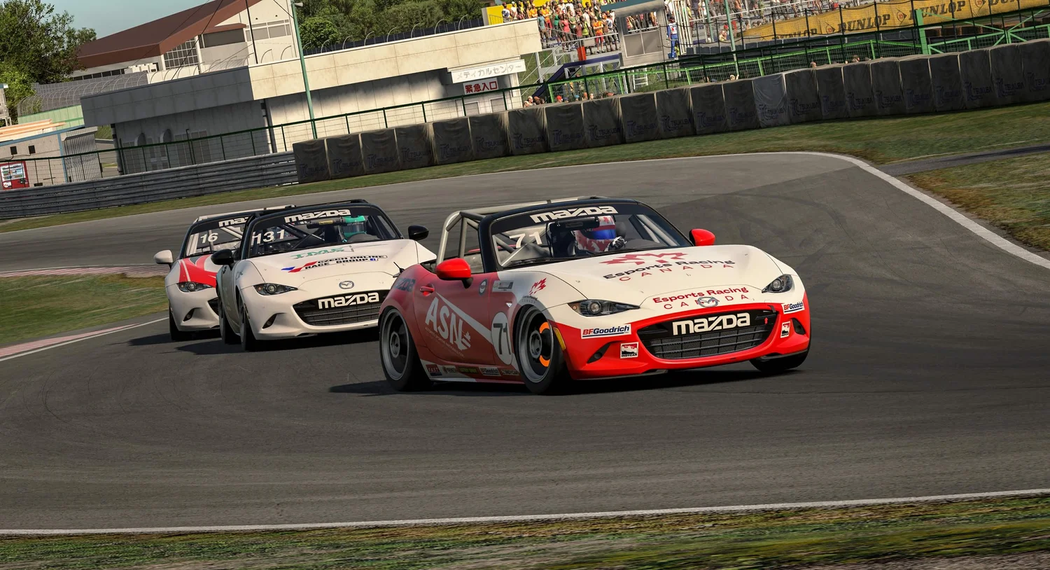 Esports Racing Canada liveried Mazda MX-5 leading a pack of cars on track