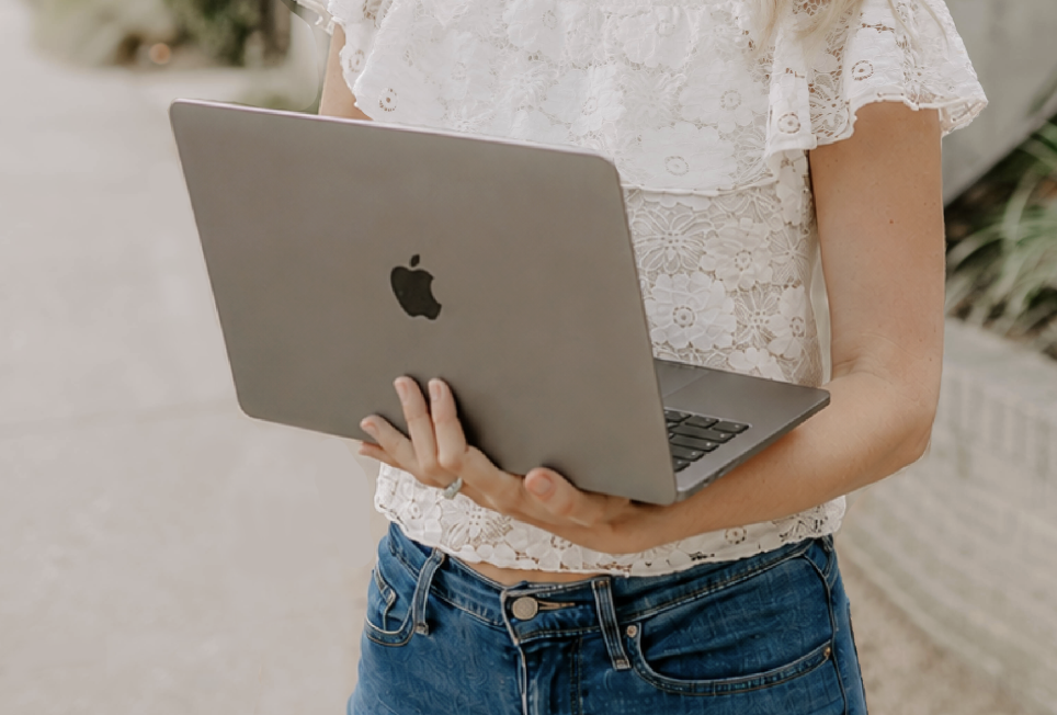 Angela working on a laptop