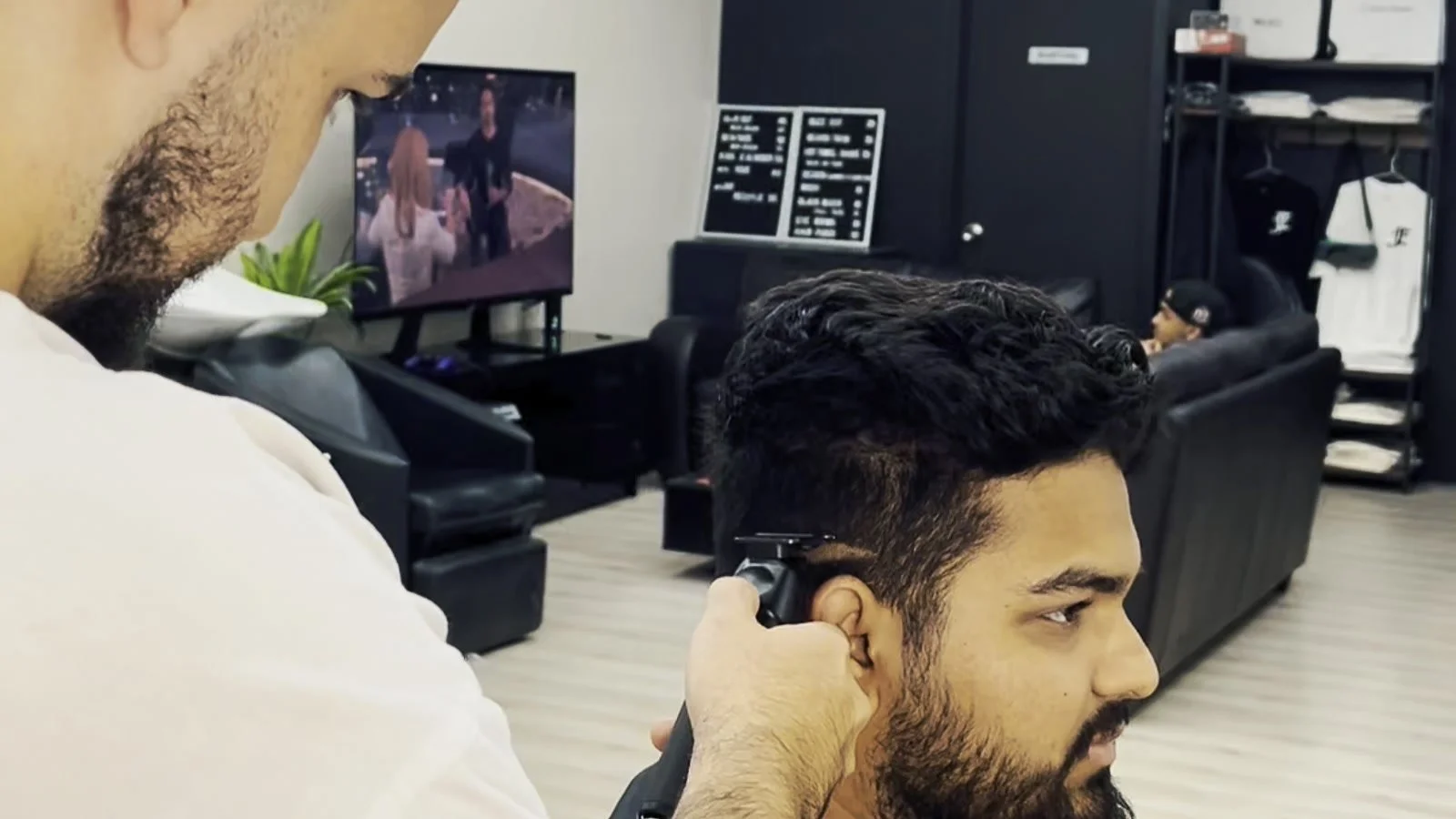 Skin fade being finished around the ear
