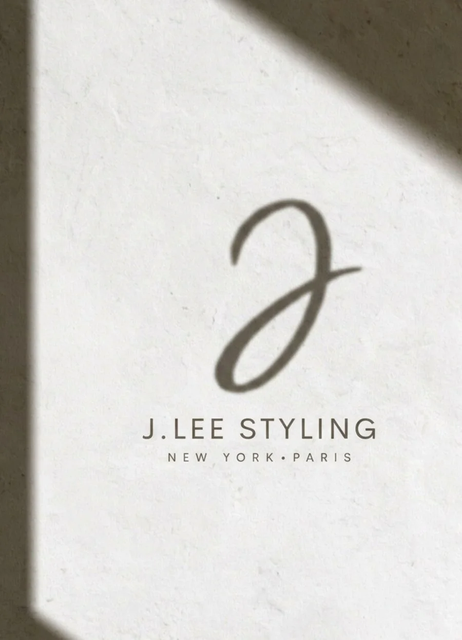 Jessica Lee Styling brand mark on a textured cream wall, soft daylight
