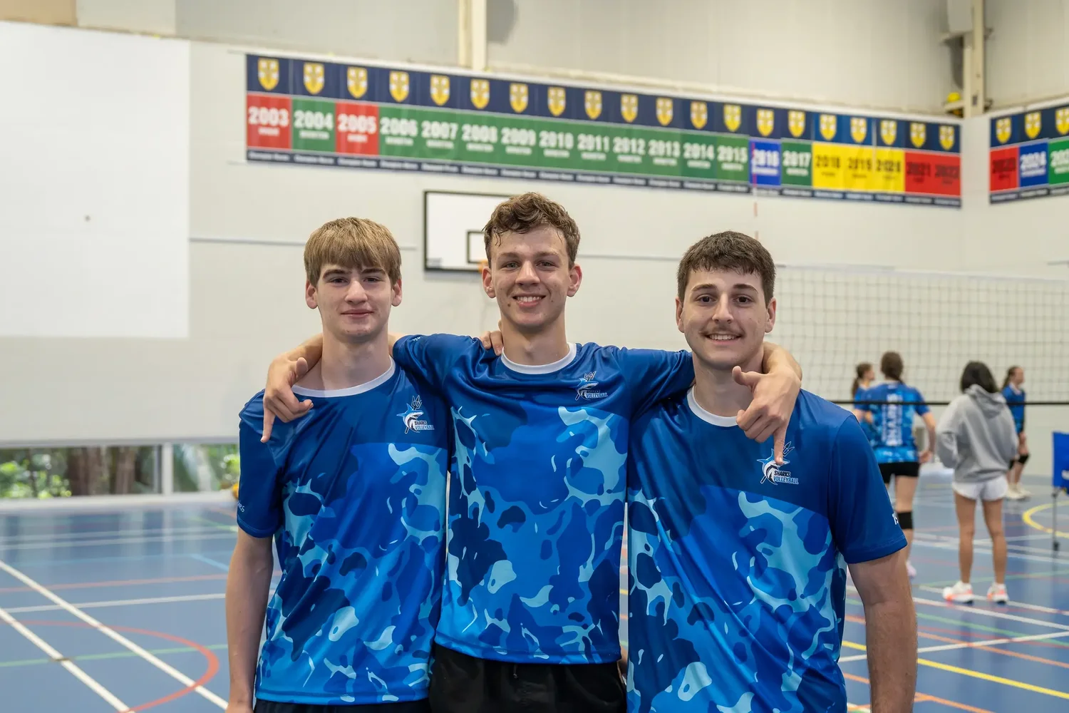 Sharks athletes together after a volleyball session