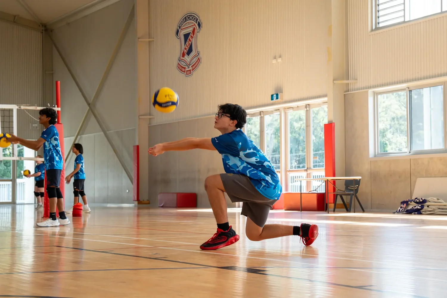 A Sharks athlete practising passing during a volleyball session