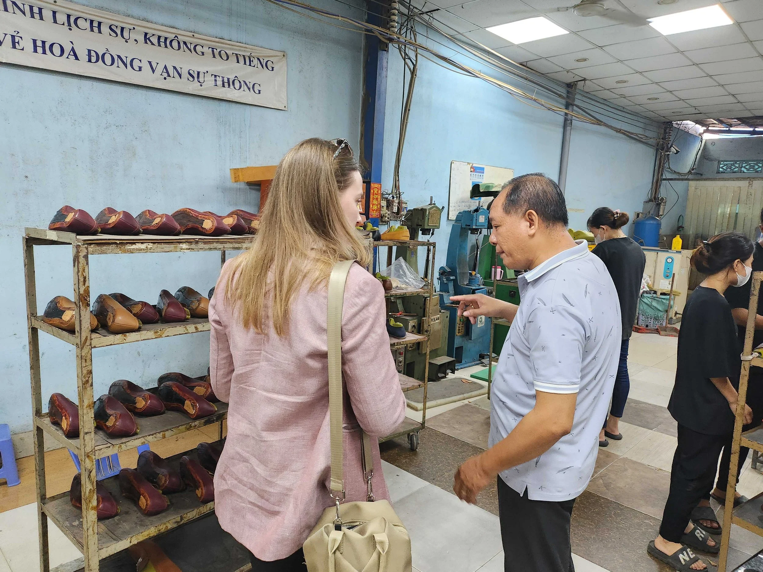 Caity Cronkhite visiting a shoe factory in Ho Chi Minh City