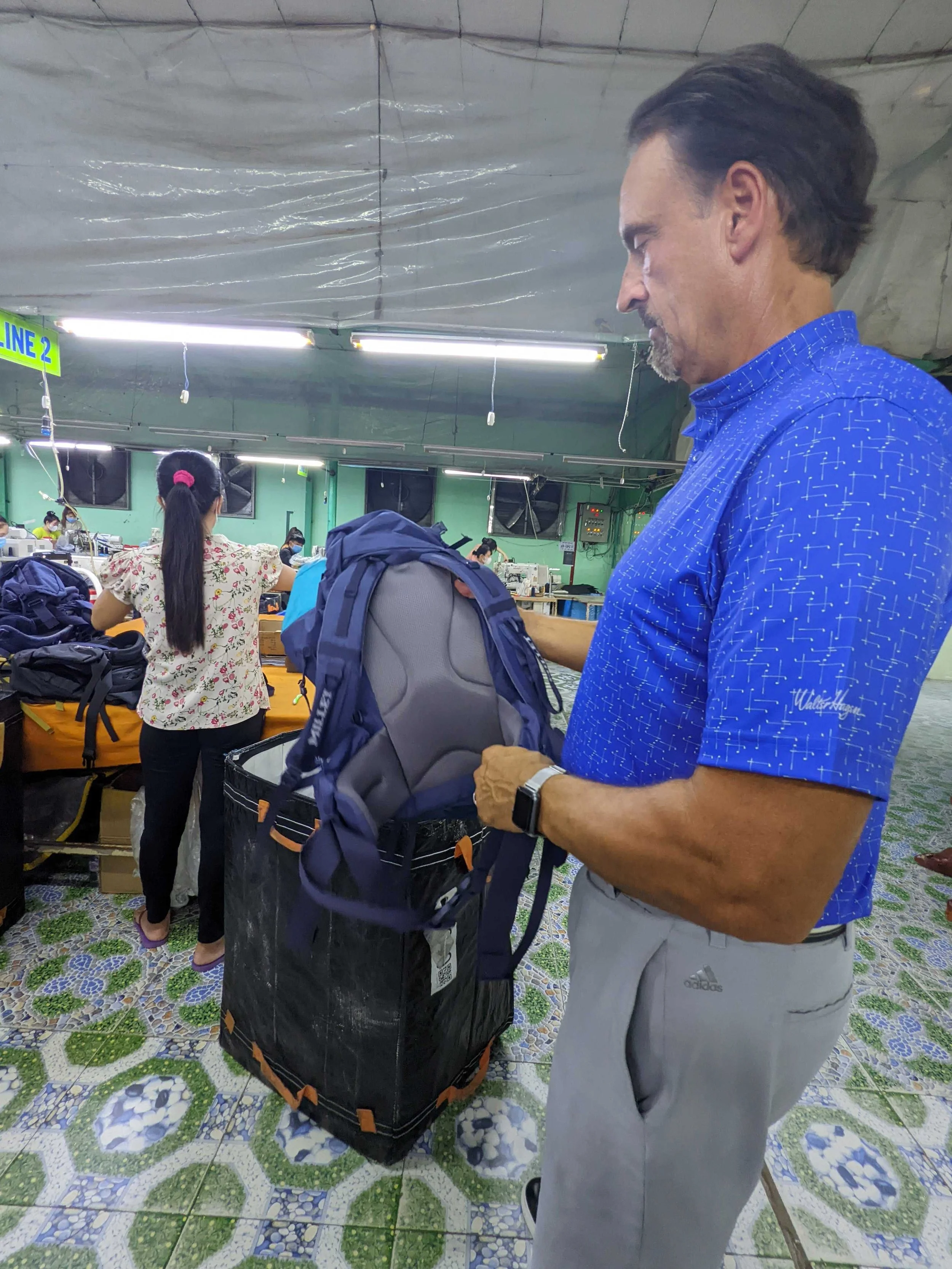 Jeff Hanning of Paradax Golf visiting a Vietnam factory with the Cosmo Sourcing team