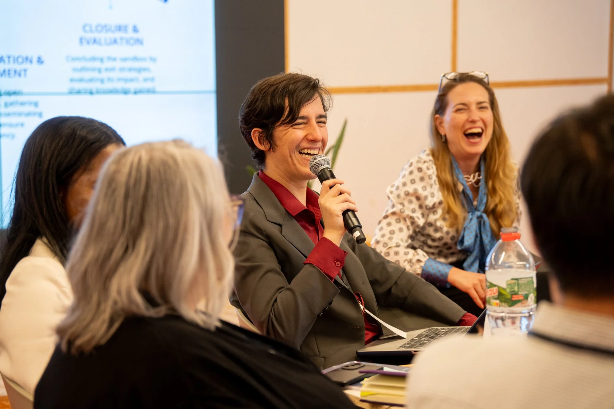 A facilitator leading a session with course participants