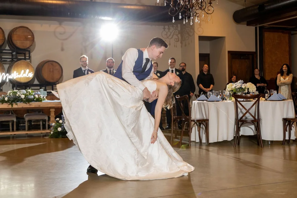 Groom dipping the bride on the reception floor at Folino Estate