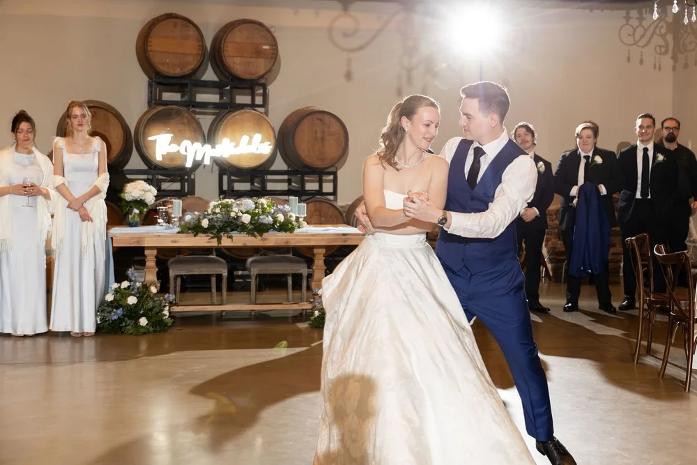 First dance in front of the wine barrel wall at Folino Estate