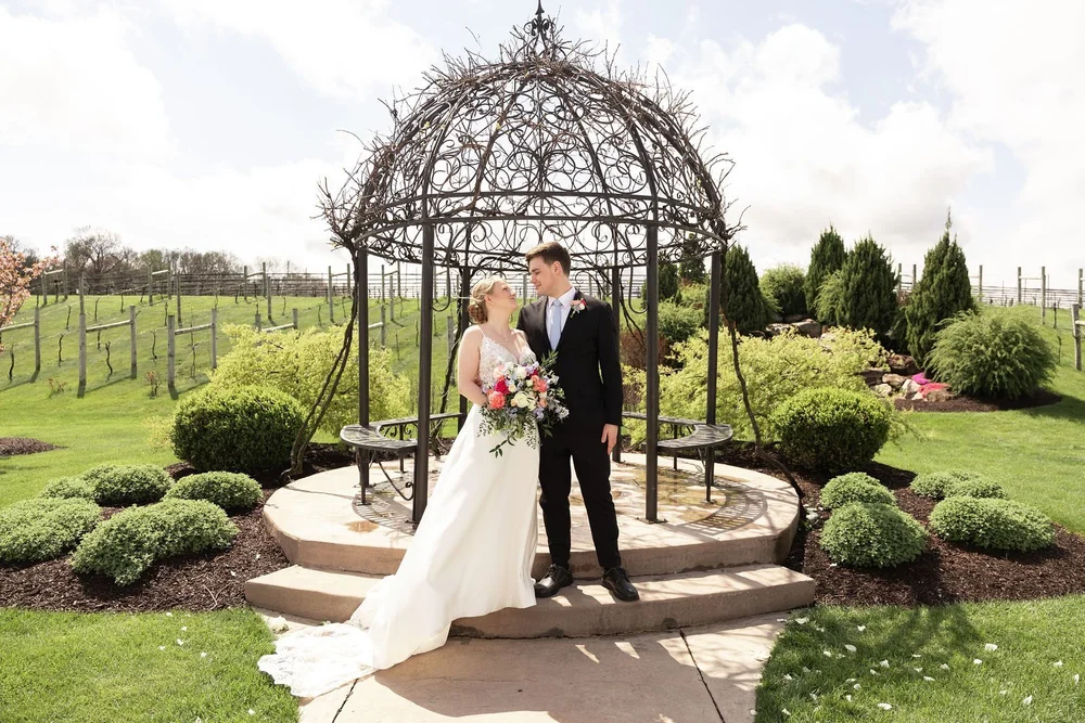 Couple at the iron gazebo in the Folino Estate gardens