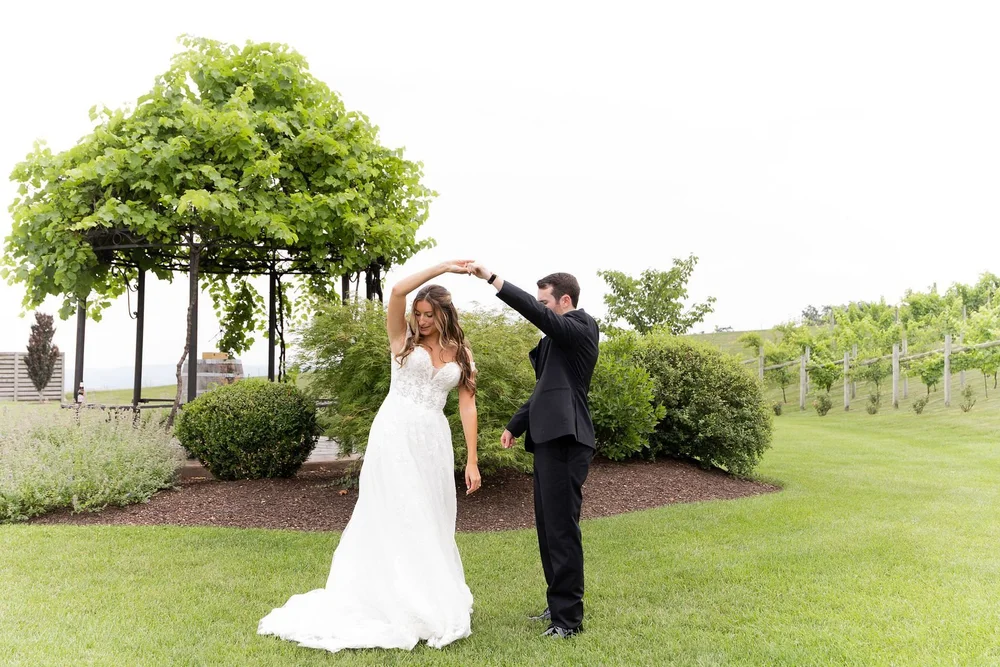Groom spinning the bride on the lawn at Folino Estate