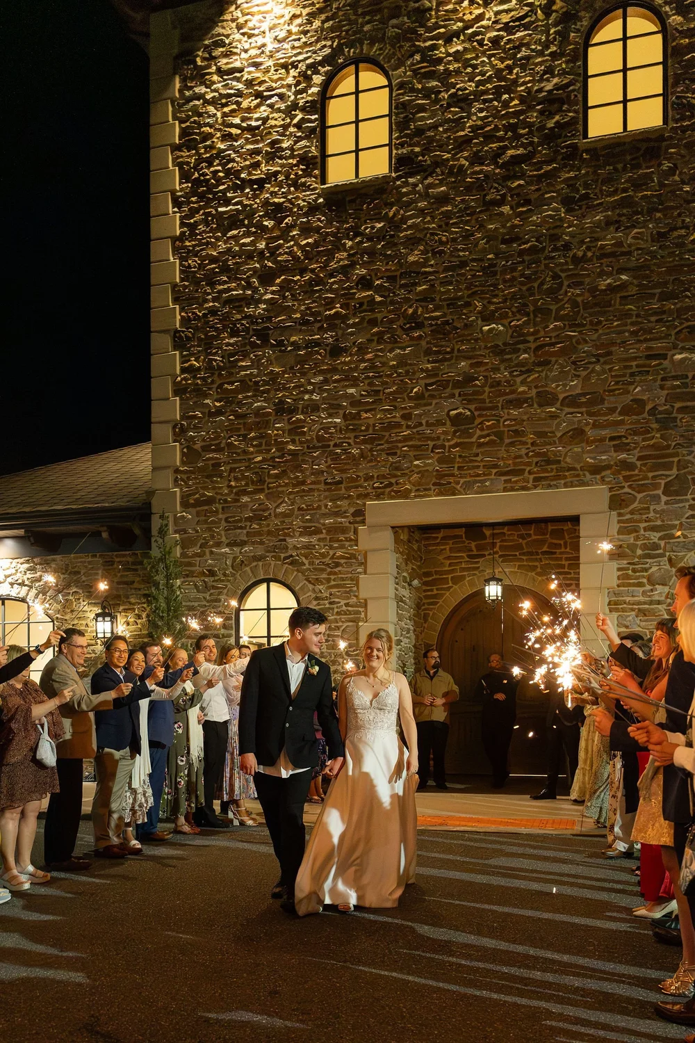 Sparkler exit from the lit stone winery building