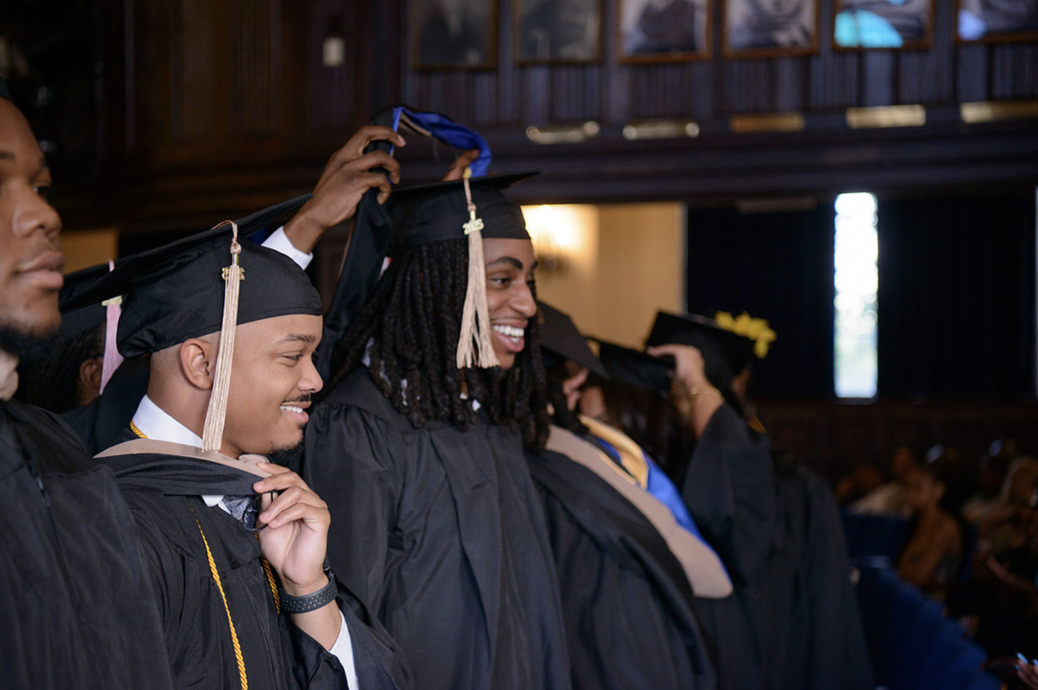 An Allen graduate receiving a hood at Commencement